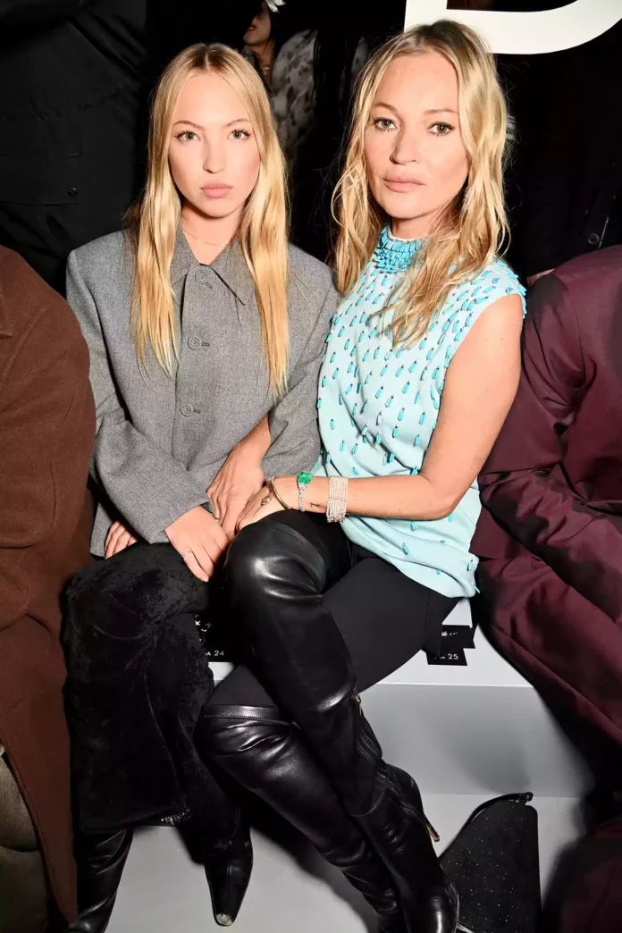 Mother-daughter duo Lila Moss (left) and Kate Moss (right) look like sisters at the Dior front row. DAVE BENETT/GETTY IMAGES